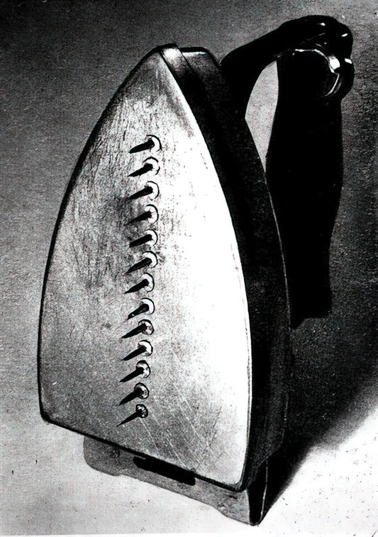Man Ray Portrait: The Surrealist Master of Photographic Innovation - THE GIFT 1921 by Man Ray